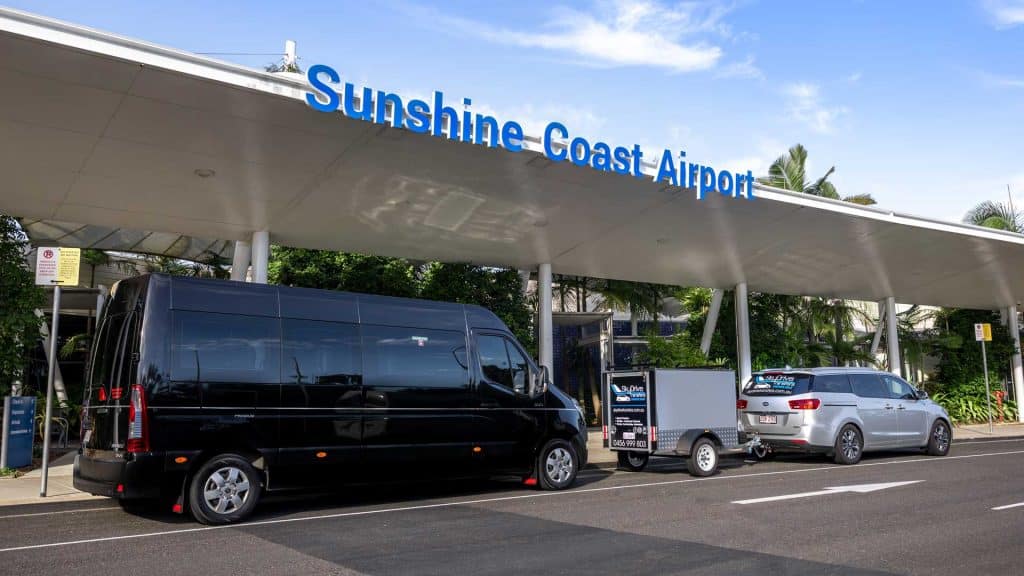 Airport Transfers Sunshine Coast - black vehicle in front of Sunshine Coast Airport